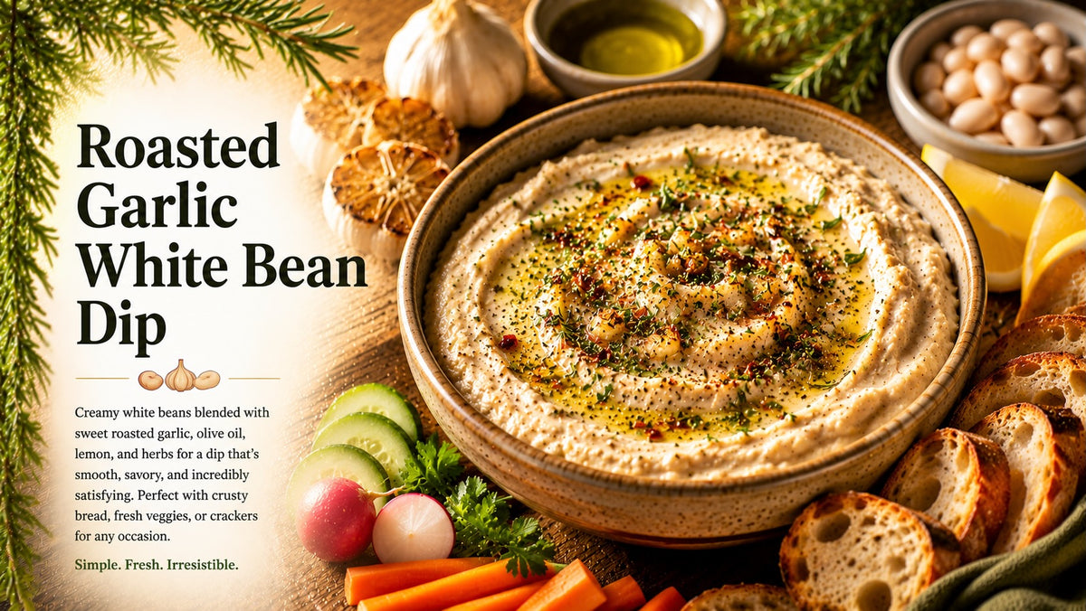 Olive Tree Marketplace recipe — Roasted garlic white bean dip — a swirled bowl of creamy white bean dip with olive oil, served with bread and fresh vegetables